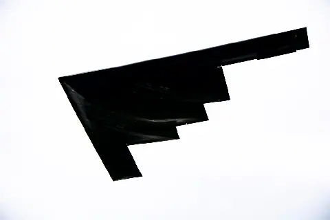 A genuine US Air Force photograph of a B-2 Spirit bomber, included as a comparison with known human flying-wing aircraft.