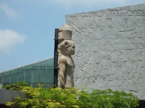 Colossal statue of a Ptolemaic ruler recovered from Alexandria's underwater archaeological site and displayed at the Bibliotheca Alexandrina.